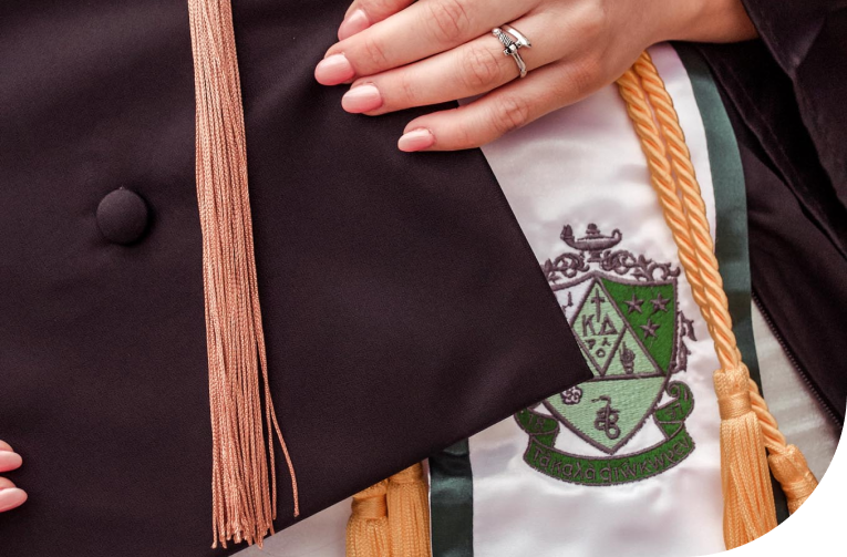 Kappa Delta collegiate sister holding graduation cap