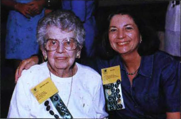 Minnie Mae Prescott and Diane LaFerney McDowell show off their rose stickers.